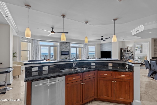 kitchen featuring dishwasher, ceiling fan, open floor plan, and a sink
