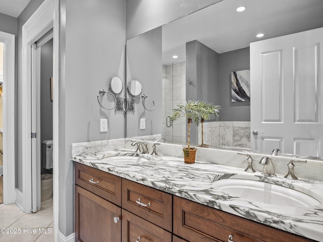 bathroom featuring vanity, tile patterned floors, and a shower with shower door