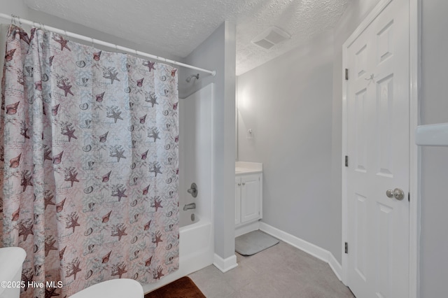 full bathroom featuring shower / bath combo, vanity, a textured ceiling, and toilet