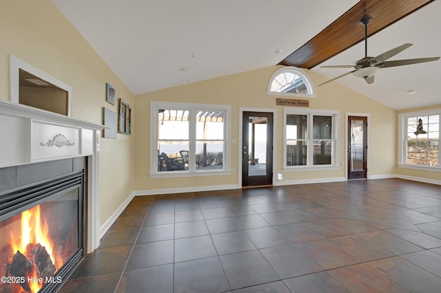 unfurnished living room featuring lofted ceiling with beams and ceiling fan