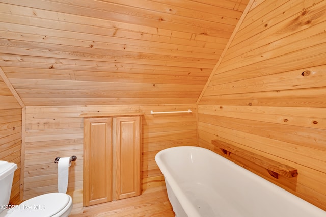 bathroom with toilet, vaulted ceiling, wooden ceiling, and wood walls