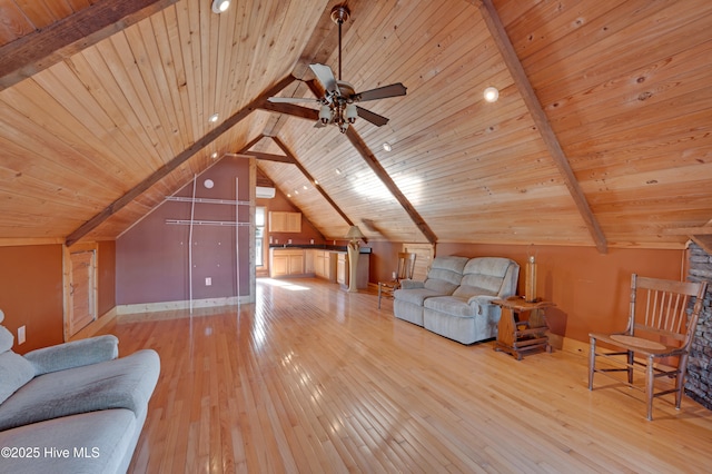 interior space with light wood-type flooring, lofted ceiling with beams, ceiling fan, and wood ceiling