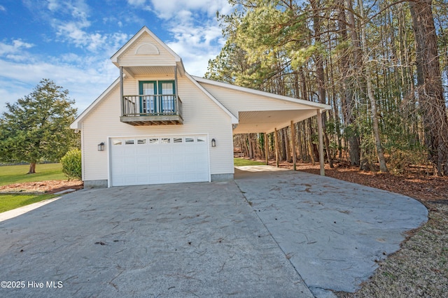 view of front facade with a balcony and a garage