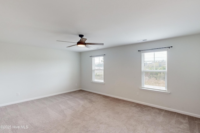 carpeted empty room with ceiling fan