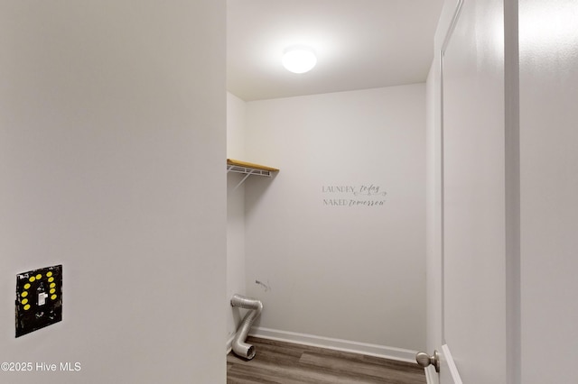 clothes washing area featuring hardwood / wood-style flooring