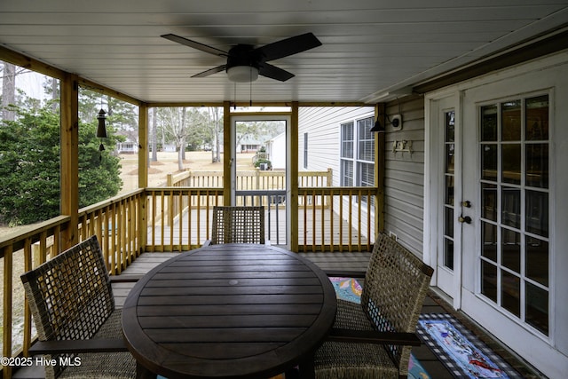 wooden terrace with ceiling fan and french doors