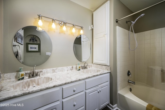 bathroom featuring vanity and tub / shower combination