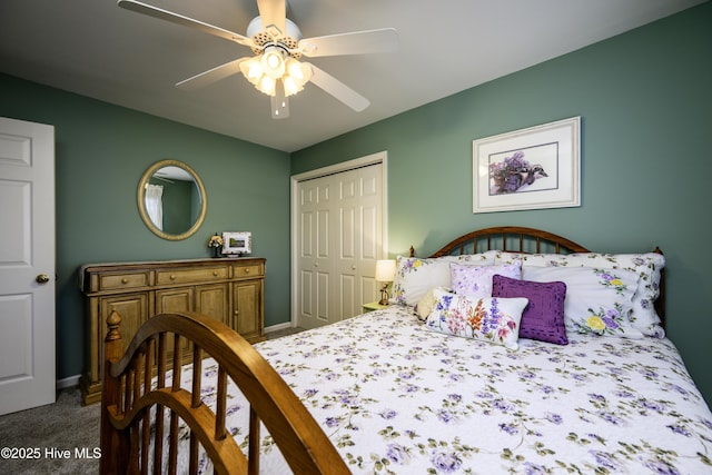 carpeted bedroom with ceiling fan and a closet