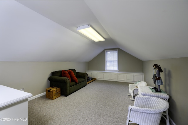 bonus room featuring light carpet and lofted ceiling