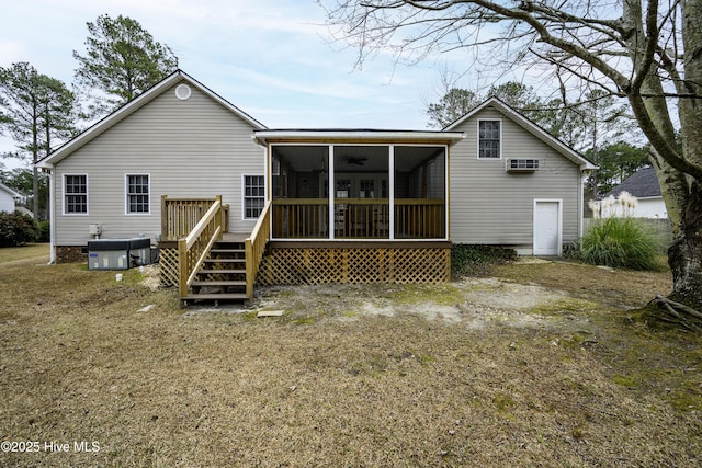 back of property with a sunroom, central AC unit, and a wooden deck