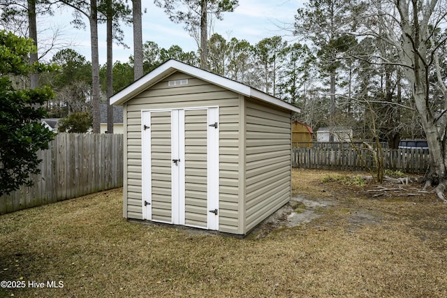 view of outbuilding with a lawn