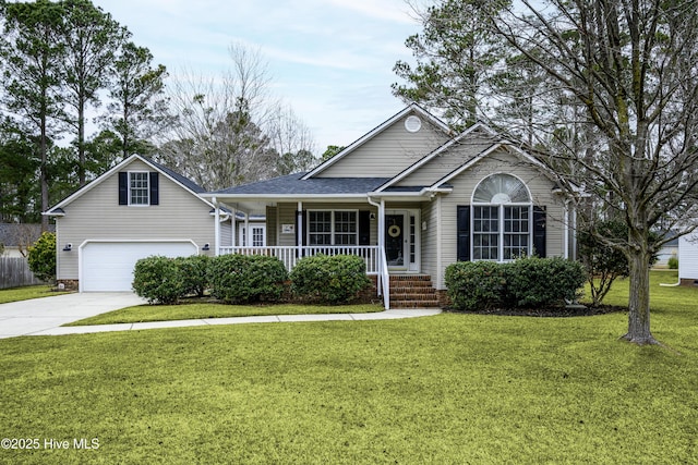 view of front of property featuring a front lawn, a porch, and a garage