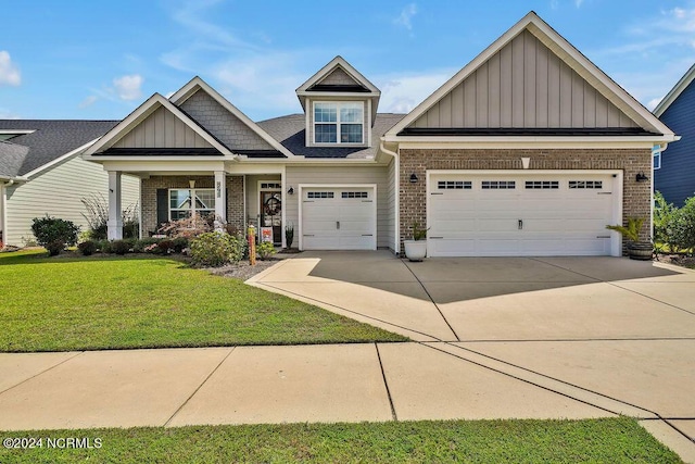 craftsman-style house with a garage and a front lawn