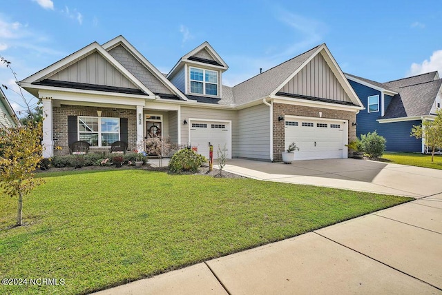 craftsman-style house with a garage and a front lawn