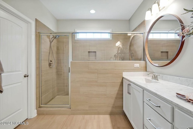 bathroom featuring vanity and walk in shower