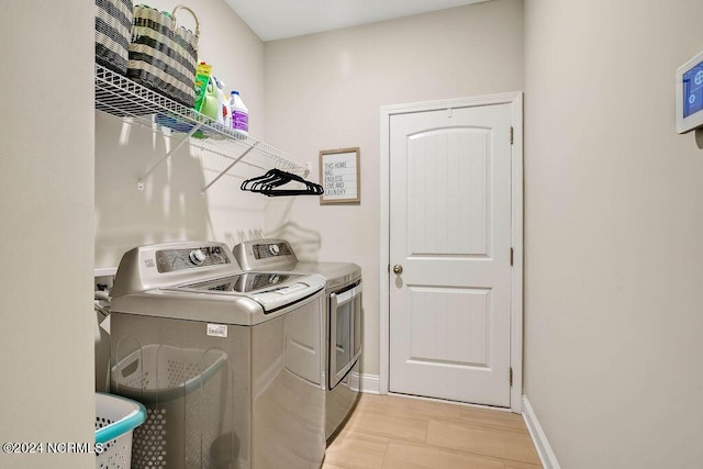 laundry room with washing machine and clothes dryer