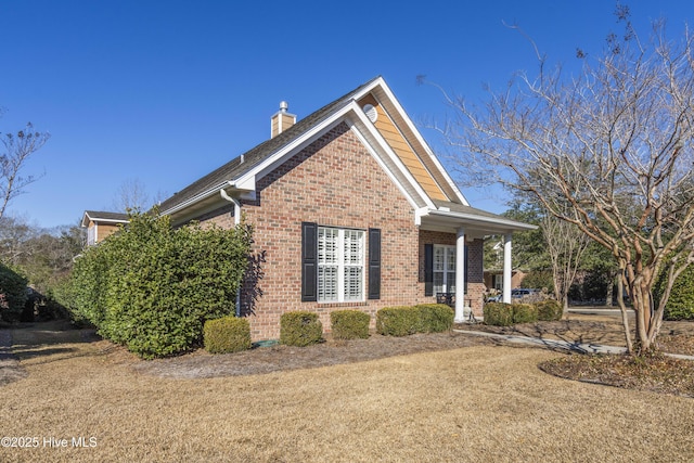 view of home's exterior with a yard