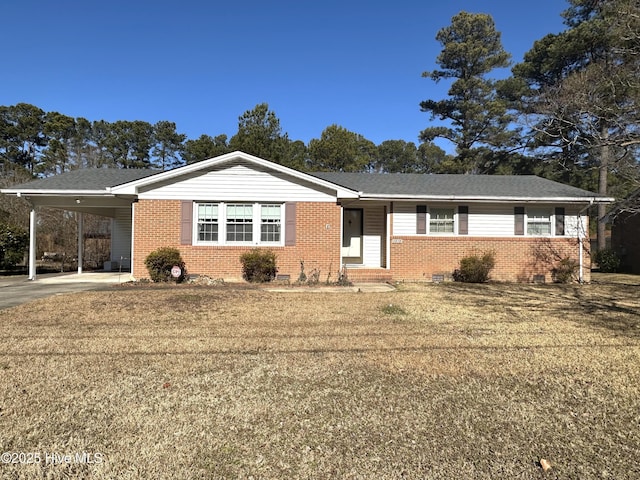 ranch-style home with a carport and a front yard