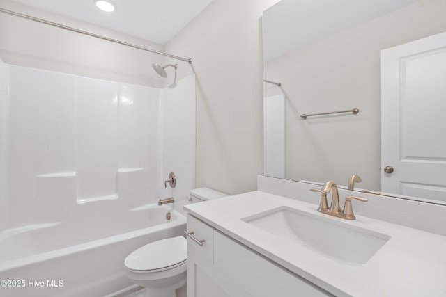 full bathroom featuring vanity,  shower combination, and toilet