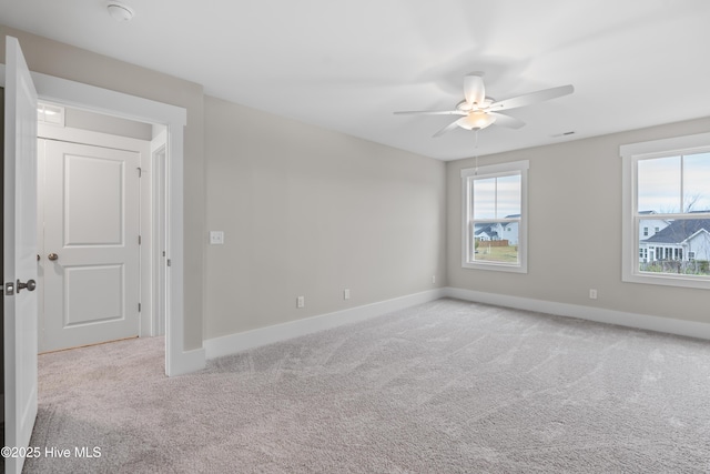 carpeted empty room with ceiling fan