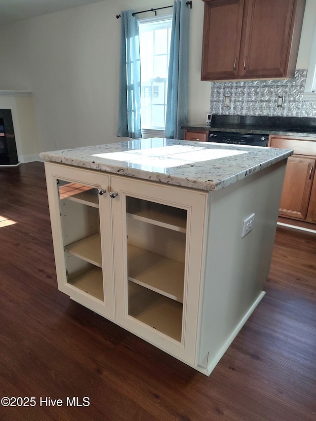 kitchen featuring wine cooler, a center island, dark hardwood / wood-style floors, and black dishwasher