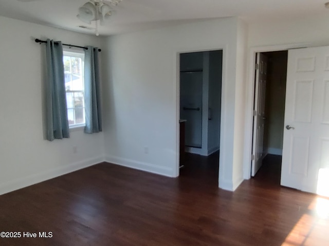 unfurnished bedroom featuring dark hardwood / wood-style floors