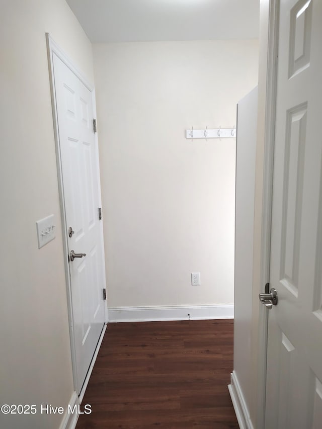 corridor featuring dark wood-type flooring