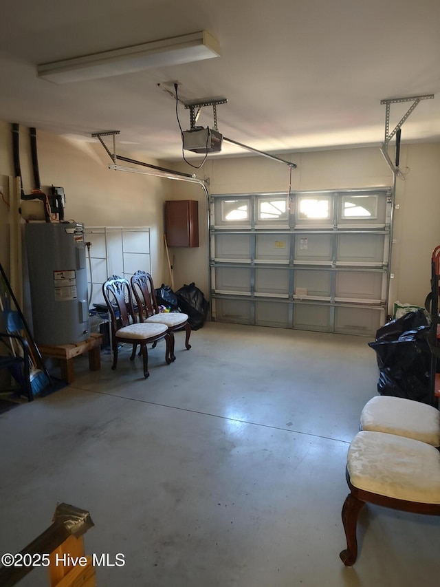 garage with electric water heater and a garage door opener