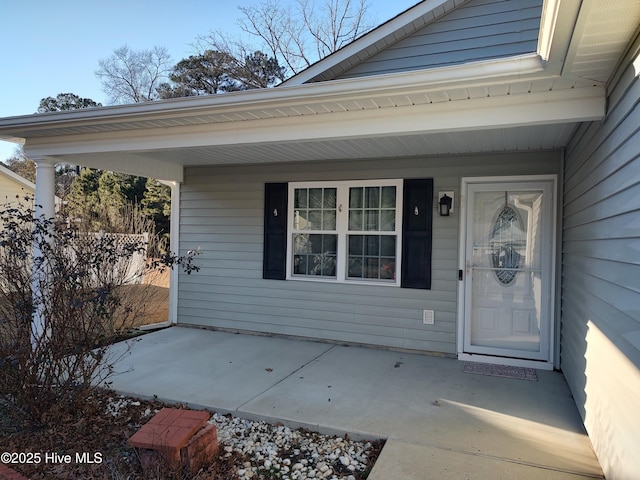 doorway to property with a porch