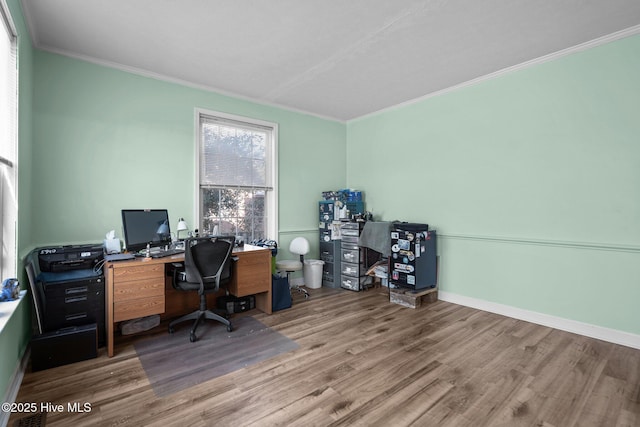 home office with crown molding and hardwood / wood-style floors