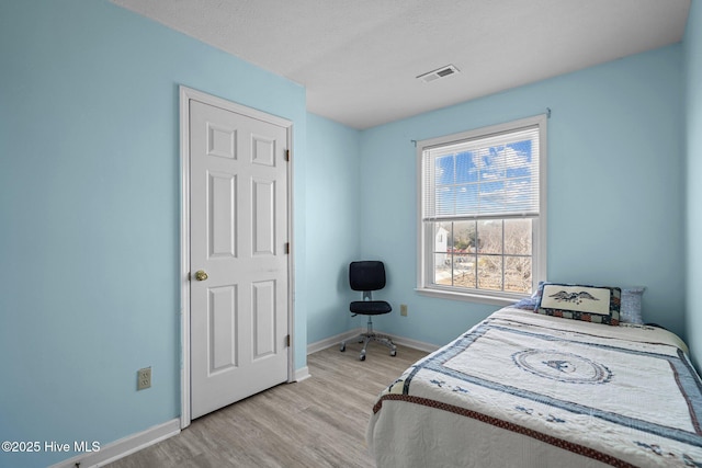 bedroom featuring light hardwood / wood-style flooring