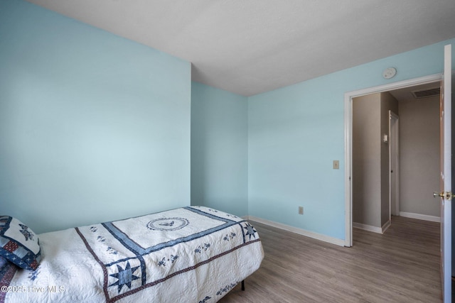 bedroom featuring hardwood / wood-style floors