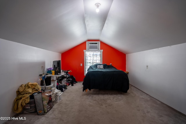 carpeted bedroom featuring lofted ceiling