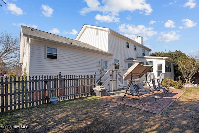 back of house with a patio area