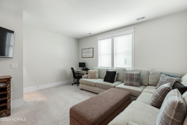 living room featuring light colored carpet