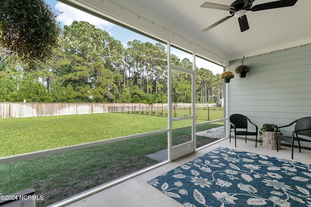 sunroom / solarium with ceiling fan