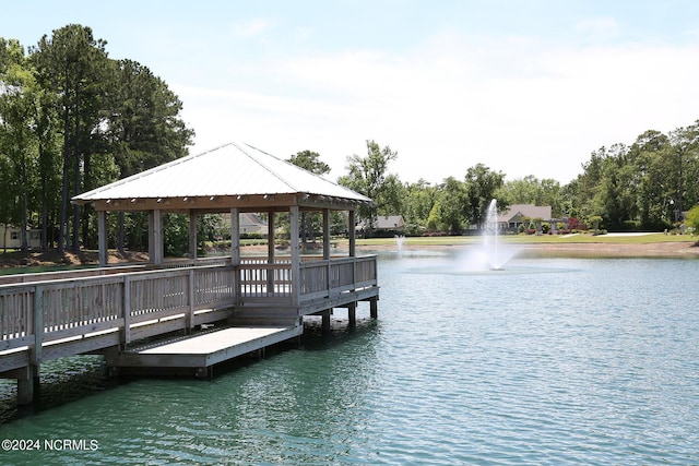 dock area with a gazebo and a water view