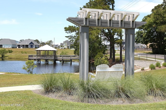 view of property's community with a gazebo and a water view