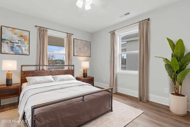 bedroom with light wood-type flooring and ceiling fan