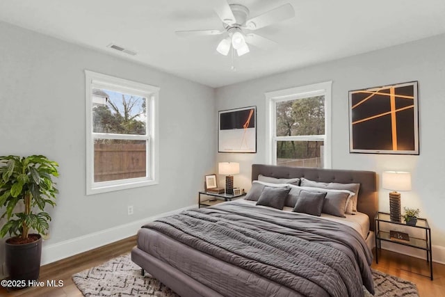 bedroom featuring wood-type flooring and ceiling fan