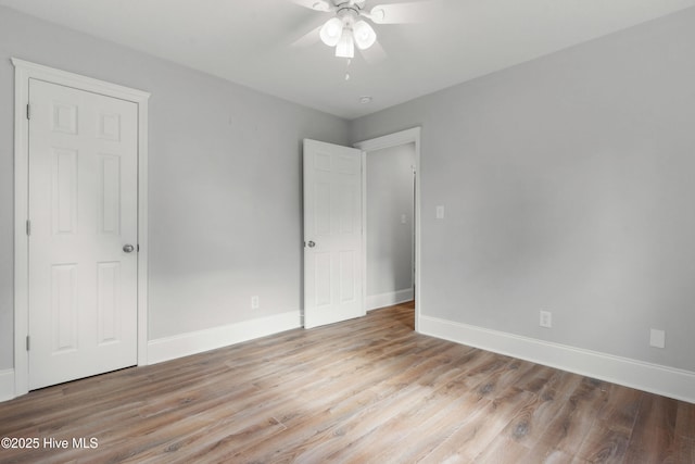 unfurnished bedroom featuring light hardwood / wood-style flooring and ceiling fan