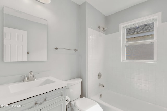 full bathroom with vanity, toilet, and tiled shower / bath