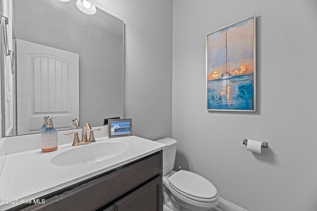 bathroom with vanity and toilet