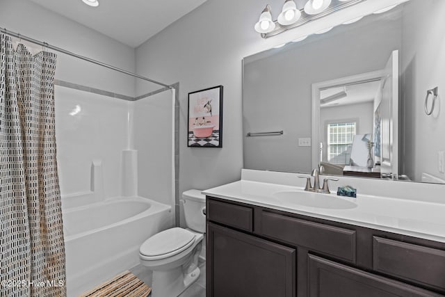 full bathroom featuring tile patterned flooring, shower / tub combo, vanity, and toilet