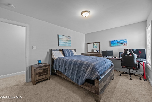 bedroom featuring light carpet