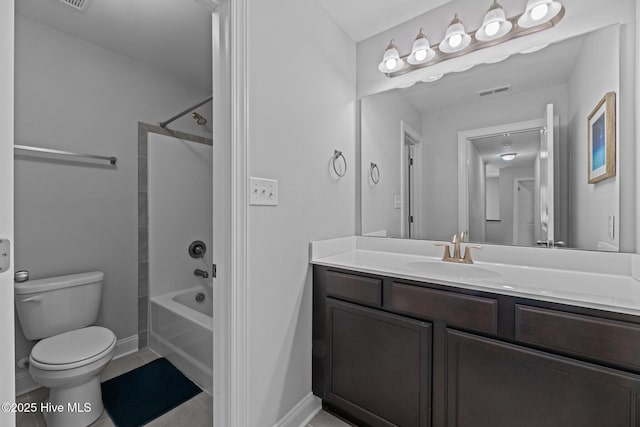 full bathroom featuring washtub / shower combination, tile patterned floors, vanity, and toilet