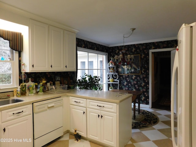 kitchen featuring kitchen peninsula, dishwasher, refrigerator, and plenty of natural light