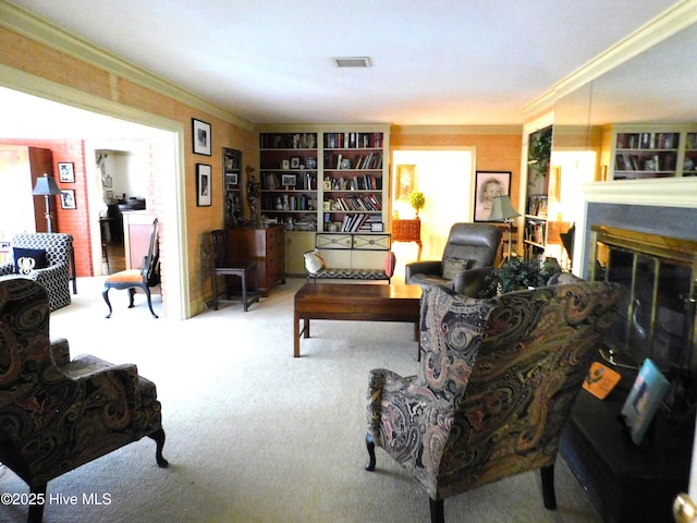 carpeted living room featuring ornamental molding