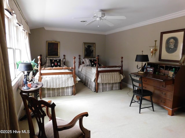 bedroom with carpet flooring, ceiling fan, and crown molding