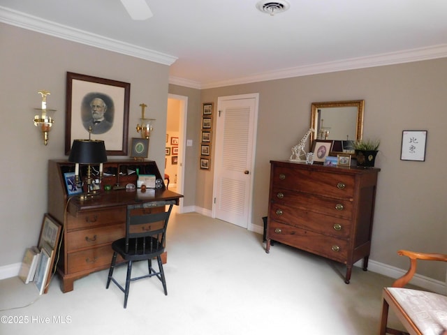 carpeted home office featuring ornamental molding